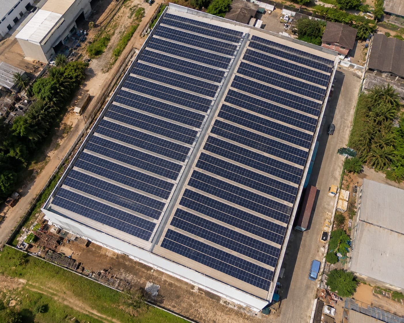 Aerial view of completed commercial solar installation on a factory rooftop in Nigeria showing 500kw panel array