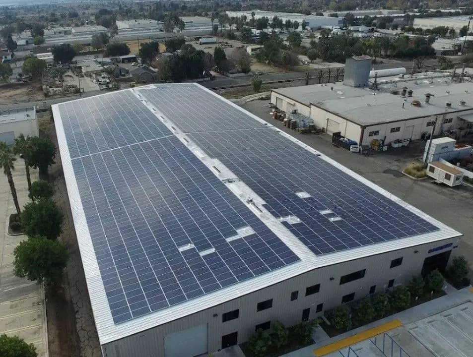 Commercial solar panel installation on a warehouse rooftop in Nigeria